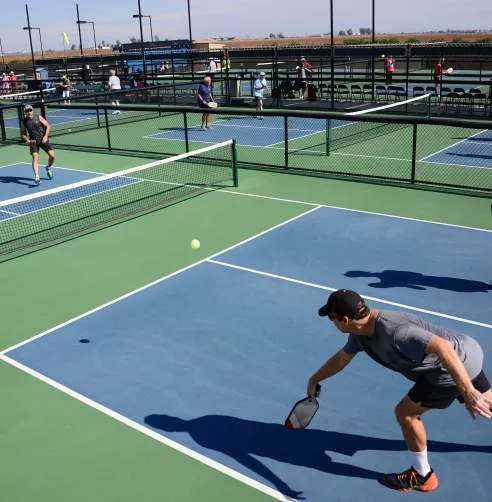 Players in a match on a completed outdoor pickleball court