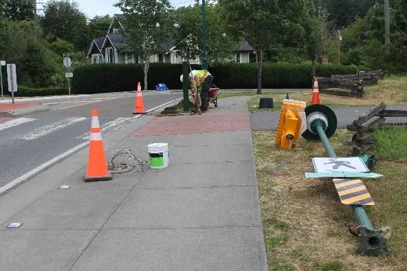 Raylec installing the pedestal for the pedestrian control button at Atkins Road crossing
