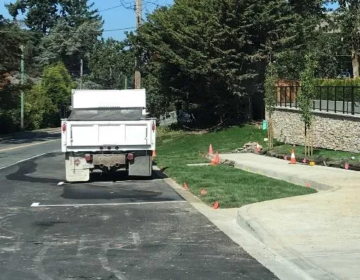 New sidewalk and intersection at Burnett Road linking to E&N Trail