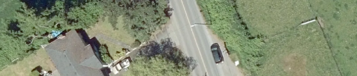 Aerial detail of a residential building and adjacent roadway