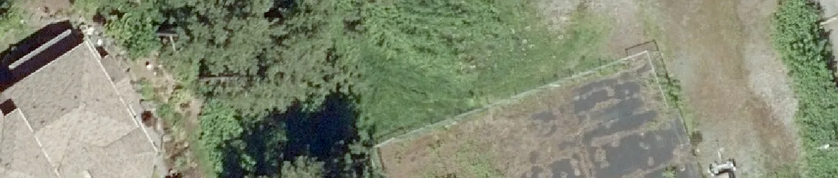 Aerial detail of a residential house and backyard area