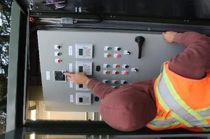 An Emery worker configuring the pressure transducer for the new Hospital pump station control kiosk
