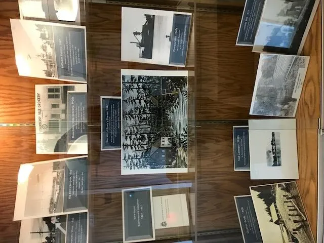 Display case of historical photographs for the "View Royal Businesses & Industries - 1847-1967" archives exhibit