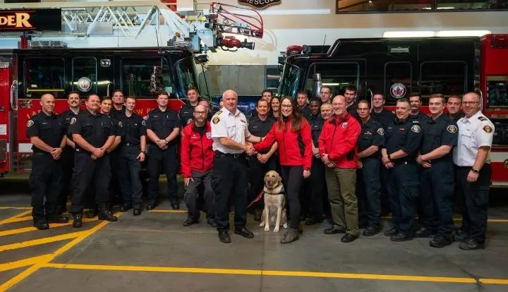 Fire Chief and Wounded Warriors representative shaking hands in front of a fire engine