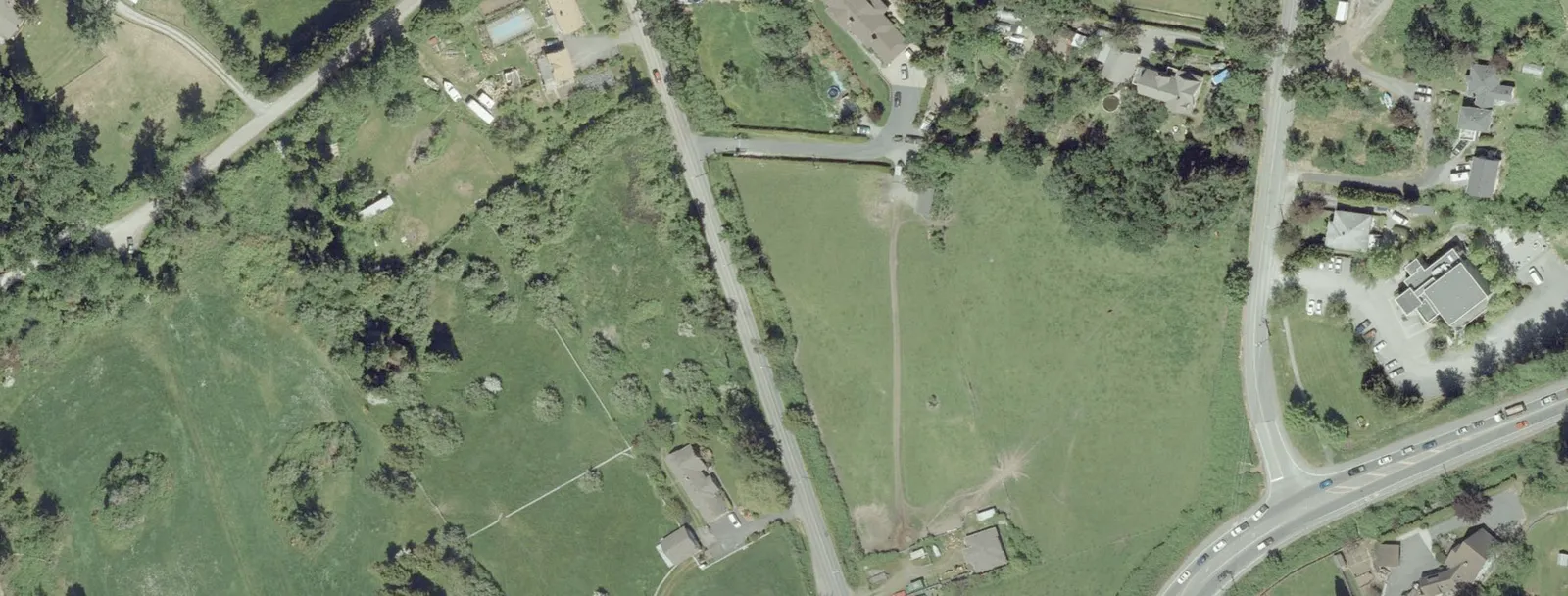 Aerial photograph showing the undeveloped site area and surrounding residential properties