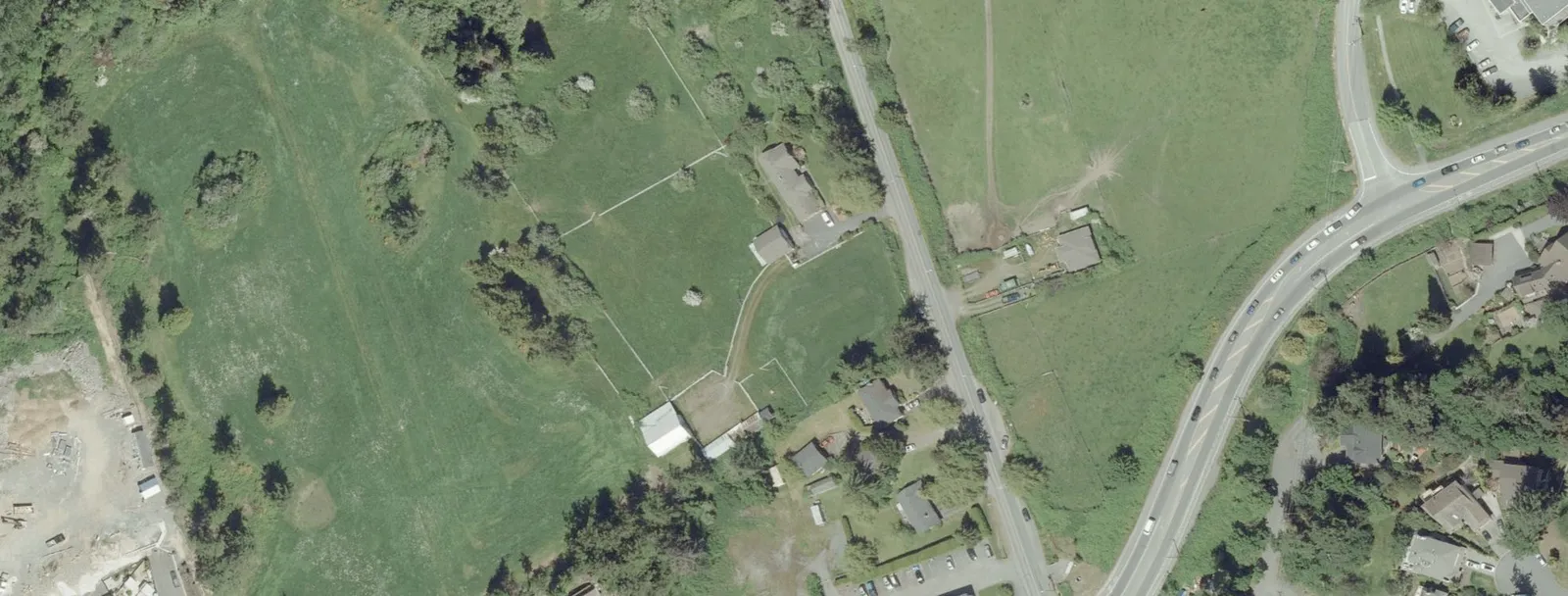 Detailed site plan layout showing building footprints, heights, and landscaping features