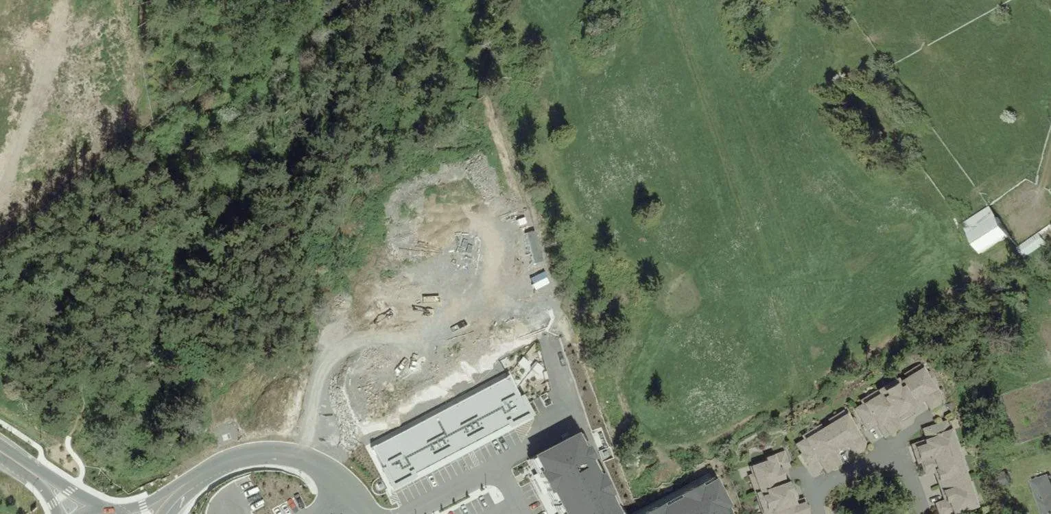 Aerial view of central field area and western construction site