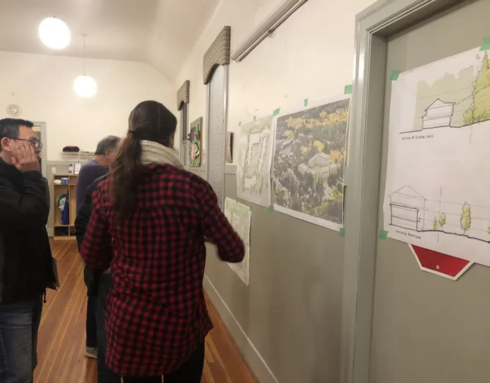 Photo of a large board titled "Your Comments" where attendees have placed numerous sticky notes with feedback on various topics.