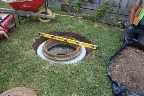 Careful and courteous sewer manhole raising in rear yard of 170 St. Giles Street