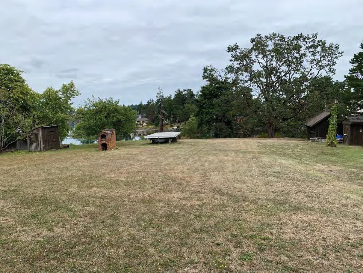Photo 19. Lawn and outbuildings outside the SDPA, looking towards the SDPA.