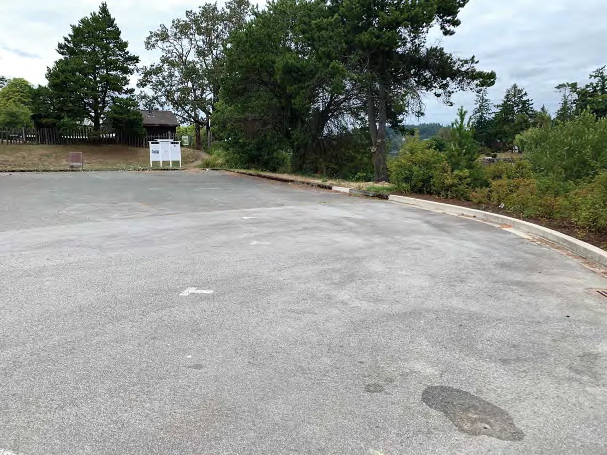 Photo 5. Parking lot in SDPA to be replaced in existing footprint, raingarden and bioswale to be installed to treat runoff on the right side of photo.