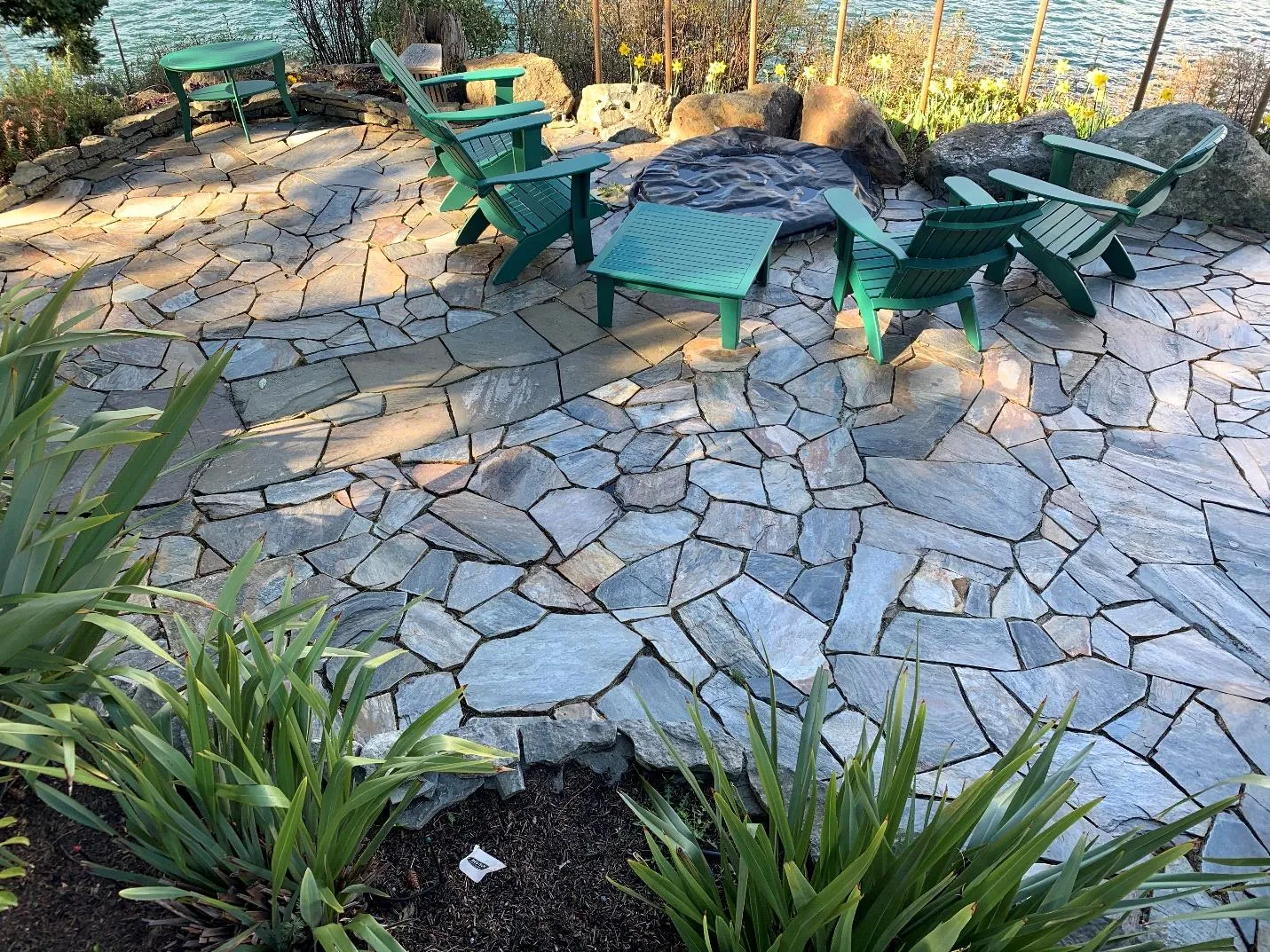 Existing stone patio and seating area at the proposed building site