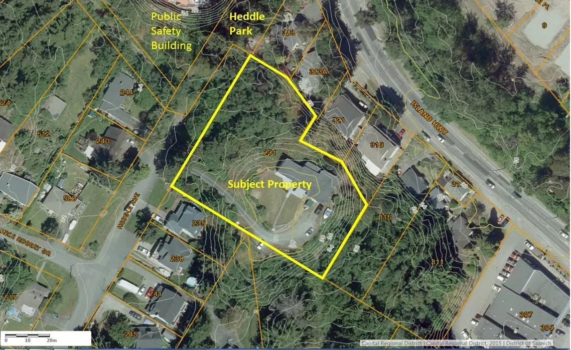 Aerial photo of the subject property at 231 Heddle Avenue, outlined in yellow, showing its proximity to Heddle Park, the Public Safety Building, and surrounding residential lots.