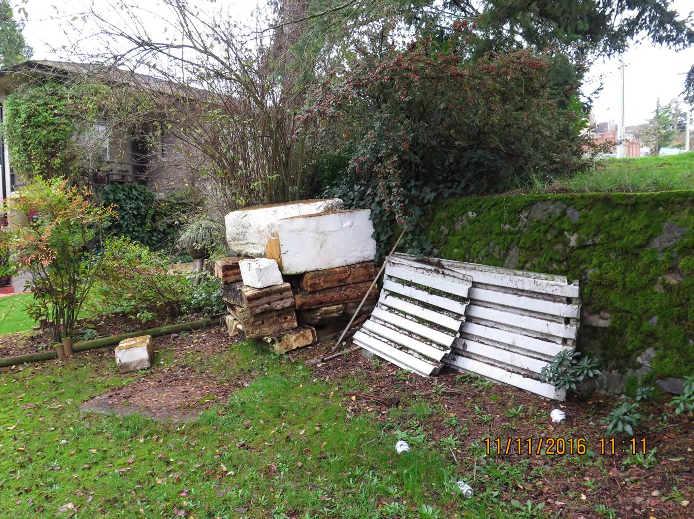 Residential waste and wood pile at Arcadia Street