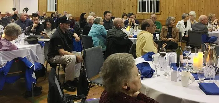 Attendees seated at tables during the annual volunteer dinner