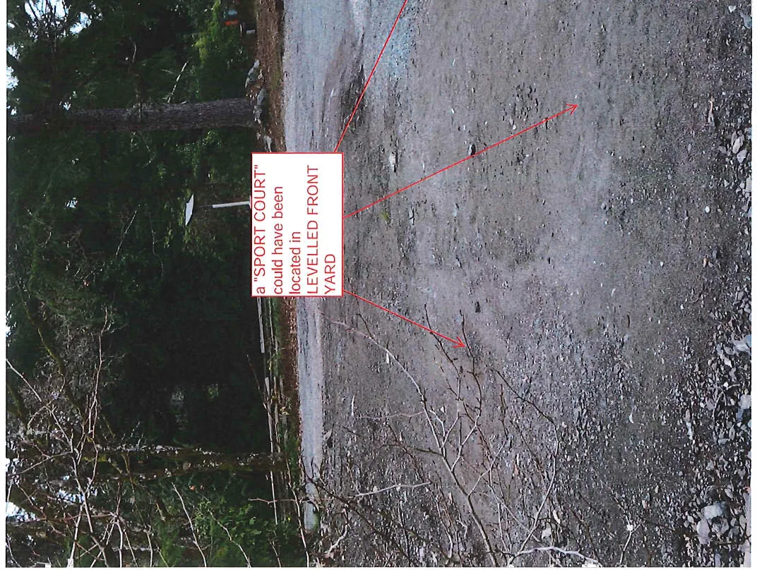 Photo of a gravel driveway area, annotated showing where a "SPORT COURT" could have been located in the 'LEVELLED FRONT YARD'