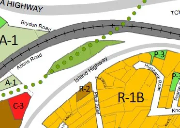 Excerpt of a zoning map showing a green-shaded area surrounded by Atkins Road, Island Highway, and Brydon Road, with zone labels like A-1, R-1B, and P-3