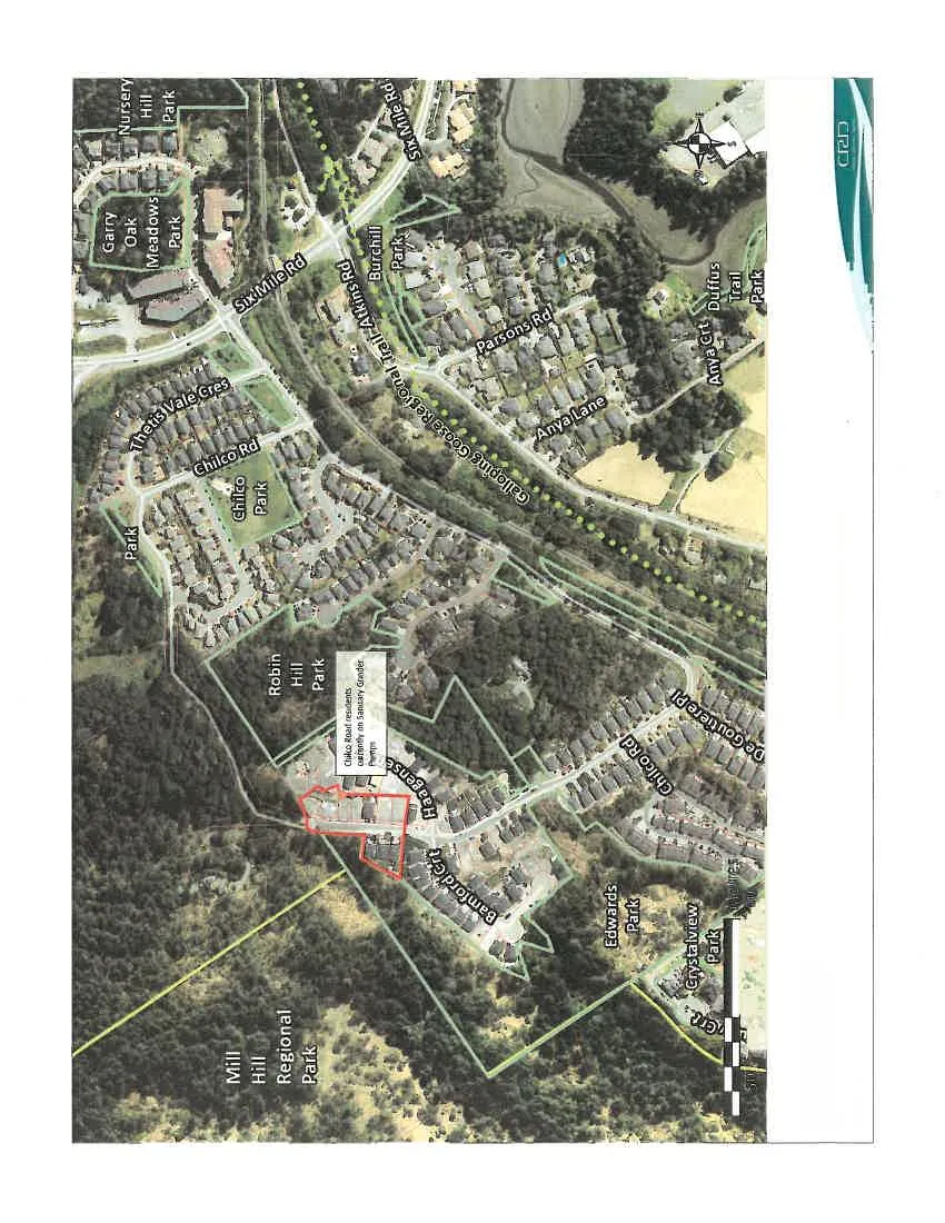 Aerial map of the Chilco Road residential area, with a red outline highlighting properties currently on sanitary grinder pumps. The map identifies various landmarks including Mill Hill Regional Park, Robin Hill Park, Chilco Park, and the Galloping Goose Regional Trail.