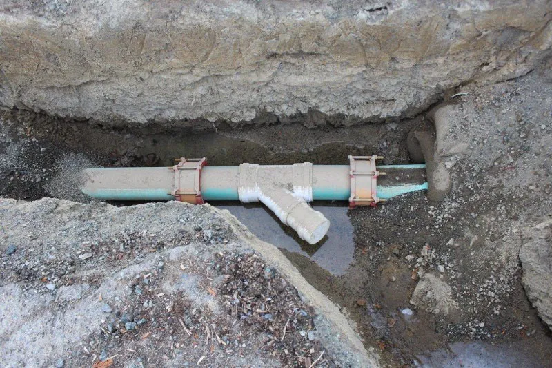 Close up of Packers PS sewer forcemain work in a trench