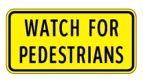 Yellow rectangular sign with "WATCH FOR PEDESTRIANS" text