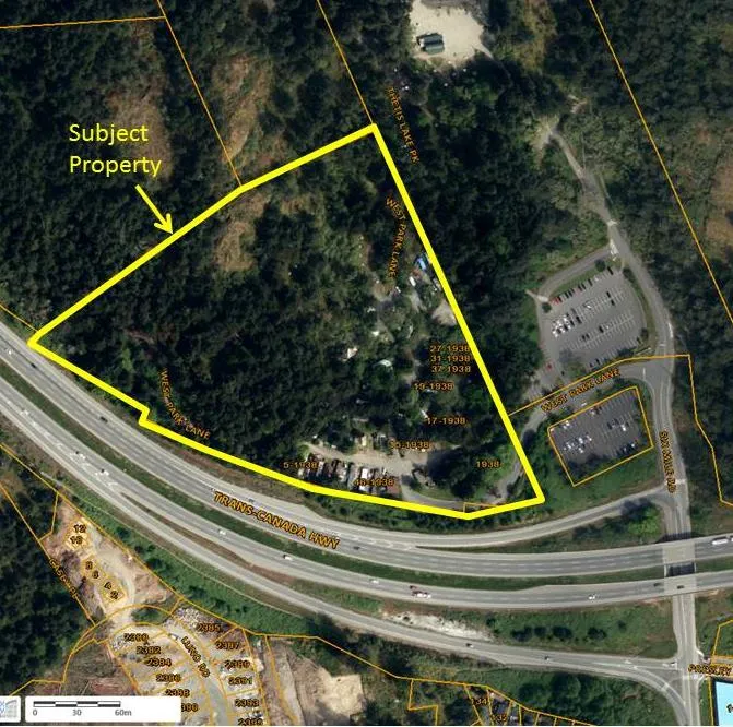 Aerial photograph highlighting the subject property at 1938 West Park Lane in yellow, showing its location relative to West Park Lane, the Trans-Canada Highway, and Thetis Lake Park.