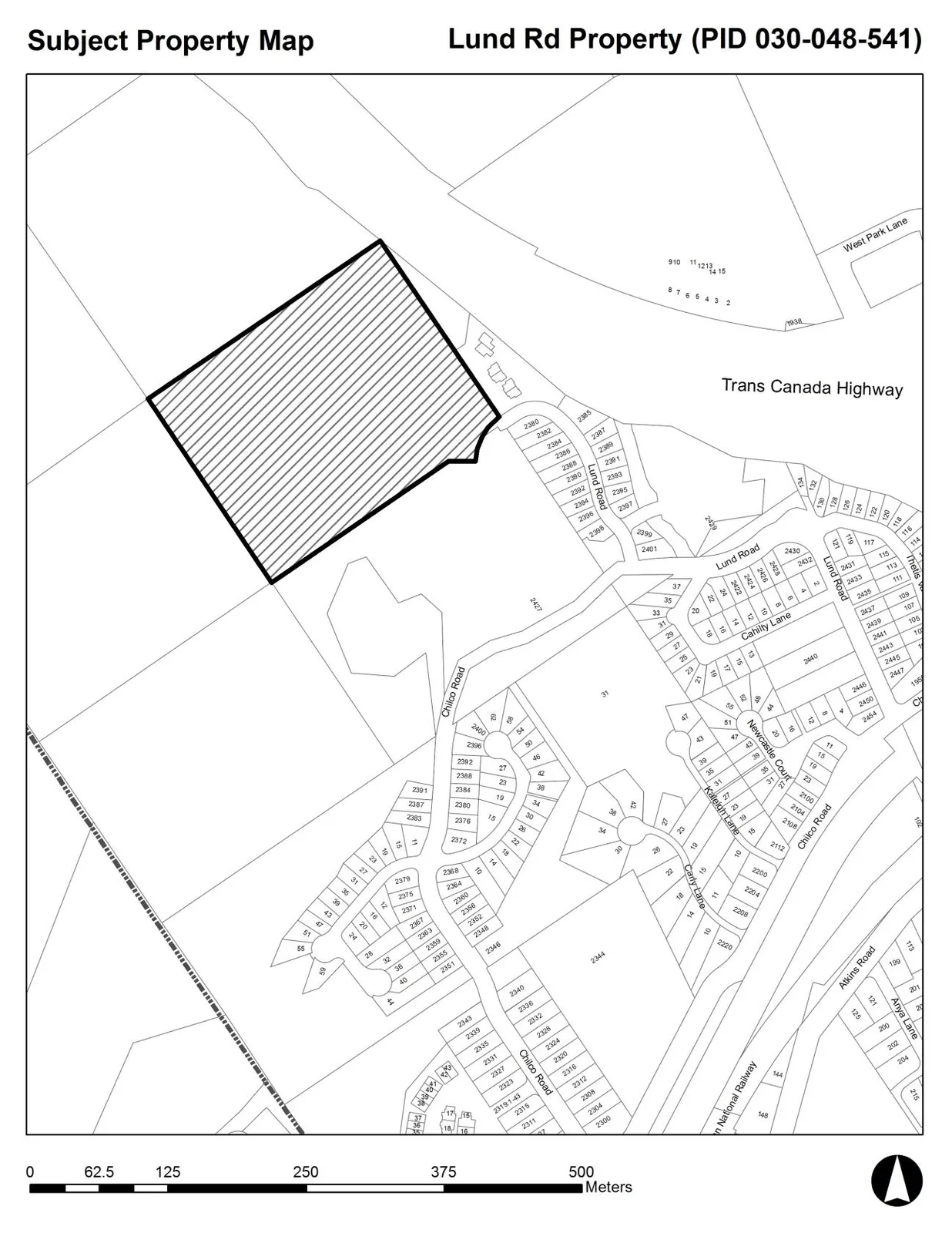 Subject Property Map showing a large hatched parcel of land (PID 030-048-541) northwest of Lund Road and Chilco Road, near the Trans Canada Highway and West Park Lane. The map includes surrounding residential lot numbers and street names such as Cahilty Lane, Newcastle Court, Kootenay Lane, Carey Lane, and Atkins Road. A scale bar at the bottom indicates a range from 0 to 500 meters.