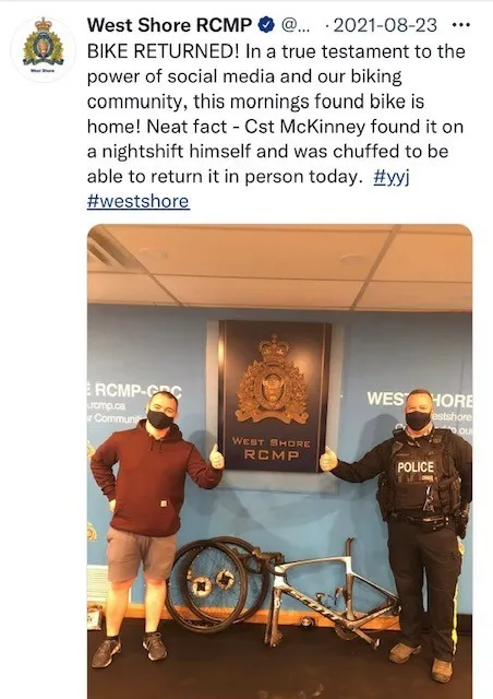 Photograph of four West Shore RCMP Bike Patrol Unit officers riding bicycles on a paved path