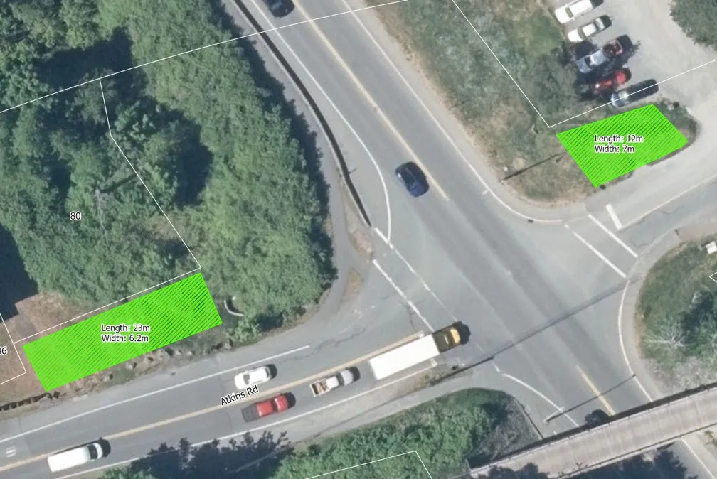 Aerial view of two large sign zones located at the intersection of Atkins Road and Six Mile Road