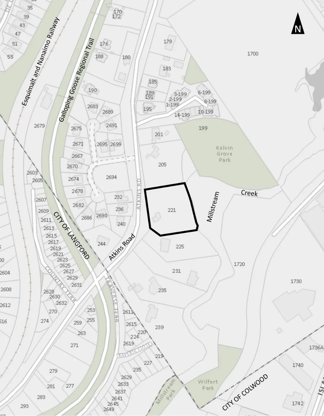 Location plan map for 221 Atkins Road, showing the property boundary highlighted in black. The map includes surrounding features such as Atkins Road, Millstream Creek, Kelvin Grove Park, Wilfert Park, the Galloping Goose Regional Trail, and the Esquimalt and Nanaimo Railway.