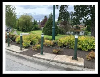 Repaired bollards and post-and-chain fencing at the roundabout