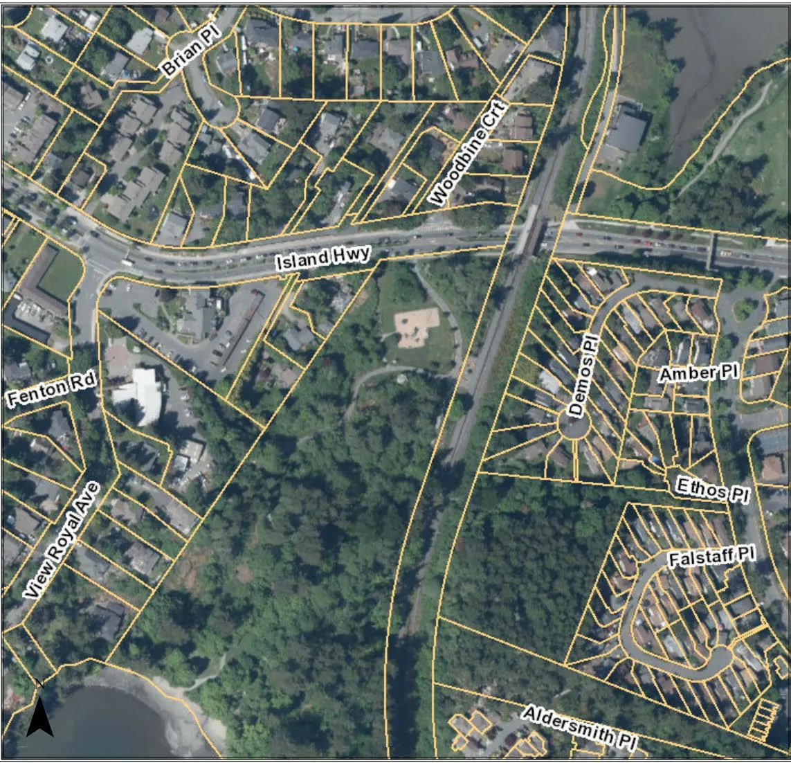 Aerial map showing property parcels with a lot outlined in red on Island Hwy, including surrounding street names such as Fenton Rd, Brian Pl, Woodbine Crt, and View Royal Ave.