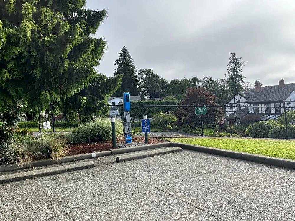 Photo of an electric vehicle charging station in a parking lot at Town Hall