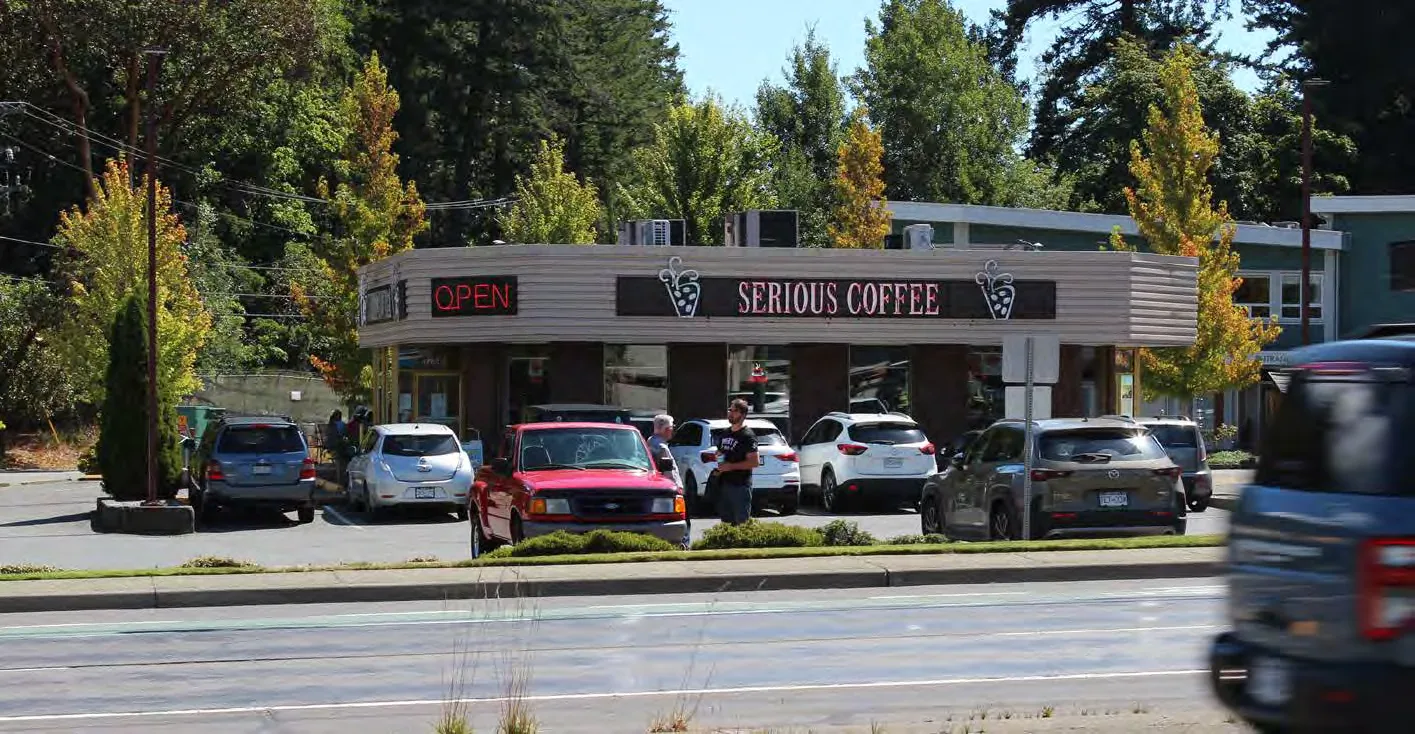 Street-level view of retail shops and parking at Eagle Creek Shopping Centre