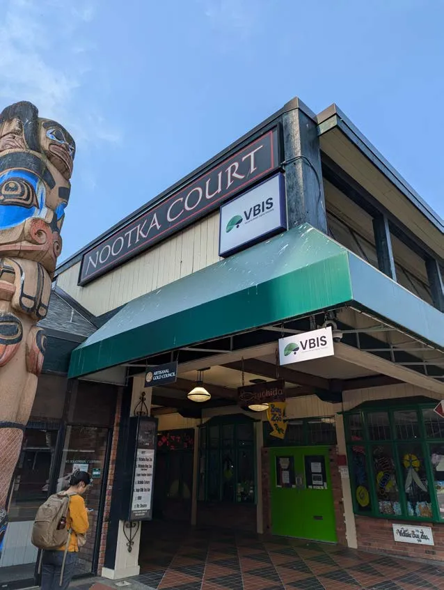 Exterior of the Nootka Court building with VBIS signage