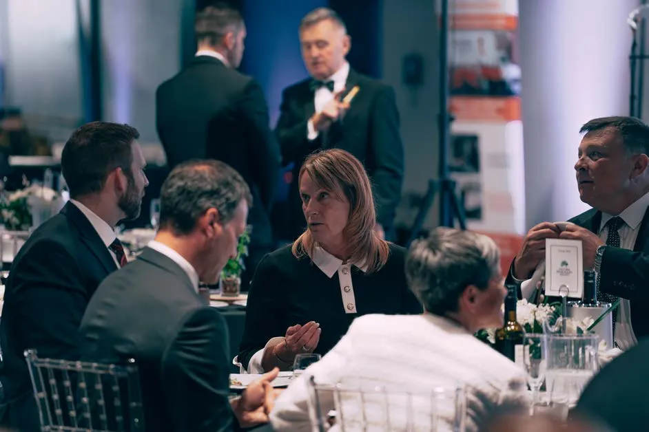 People sitting at a table during the gala