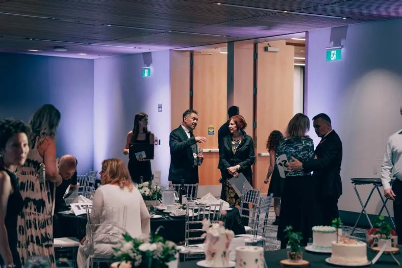 Attendees at a formal gala dinner
