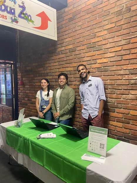 Staff or volunteers at an indoor registration desk