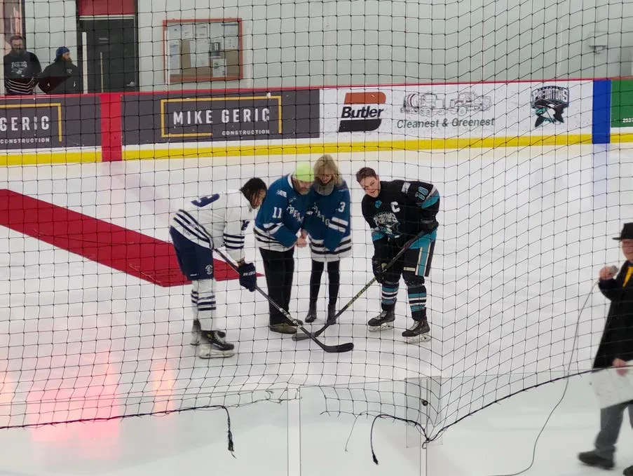 Ceremonial puck drop at a hockey game