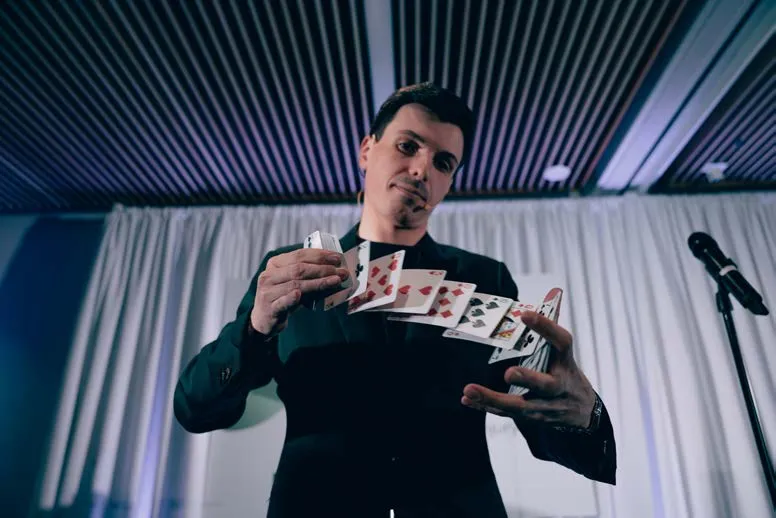 Close-up of a magician performing a card trick