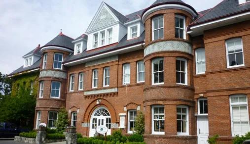 The historic red brick exterior of the Cridge Centre