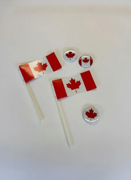 Canada Day promotional giveaway items including mini flags and buttons