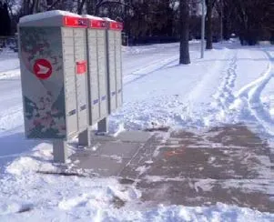 Community mailboxes in a snowy landscape