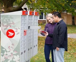 Two people at a community mailbox