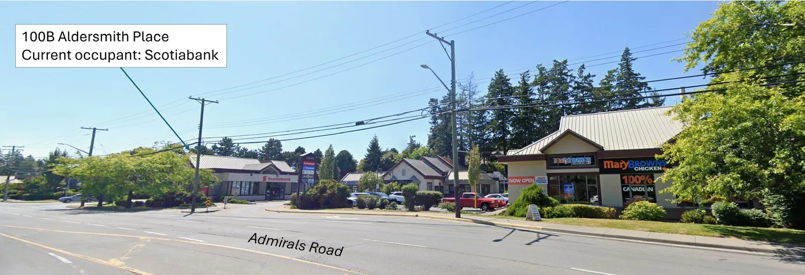 Southbound street view from Admirals Road showing the Scotiabank building and adjacent retail