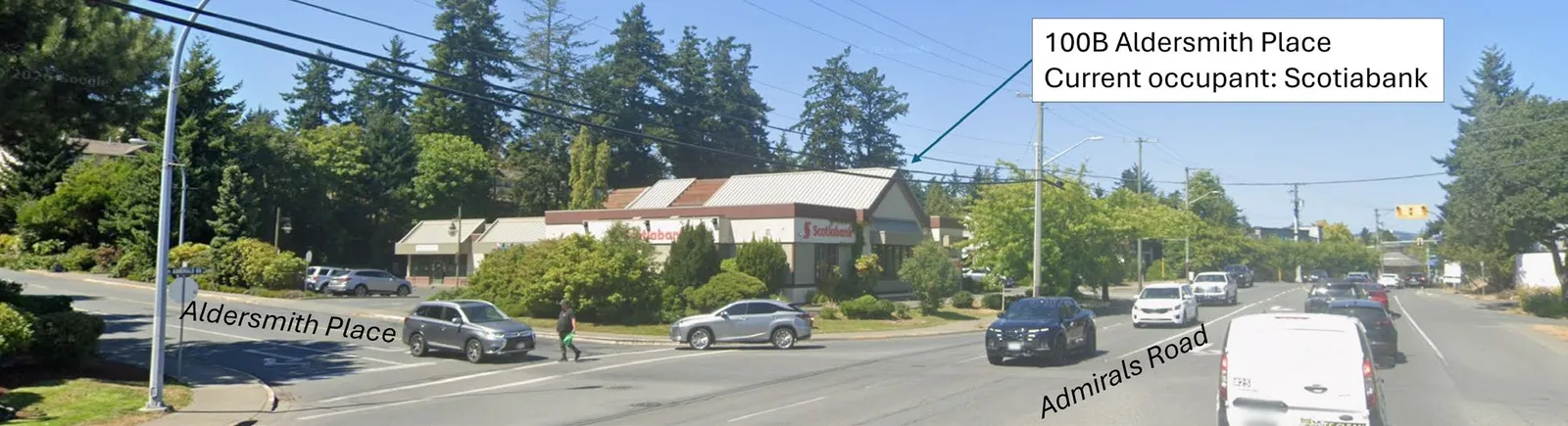 Northbound street view from Admirals Road showing the intersection and the commercial site