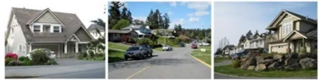 Photo of a blue detached house with a gravel driveway and small boat trailer