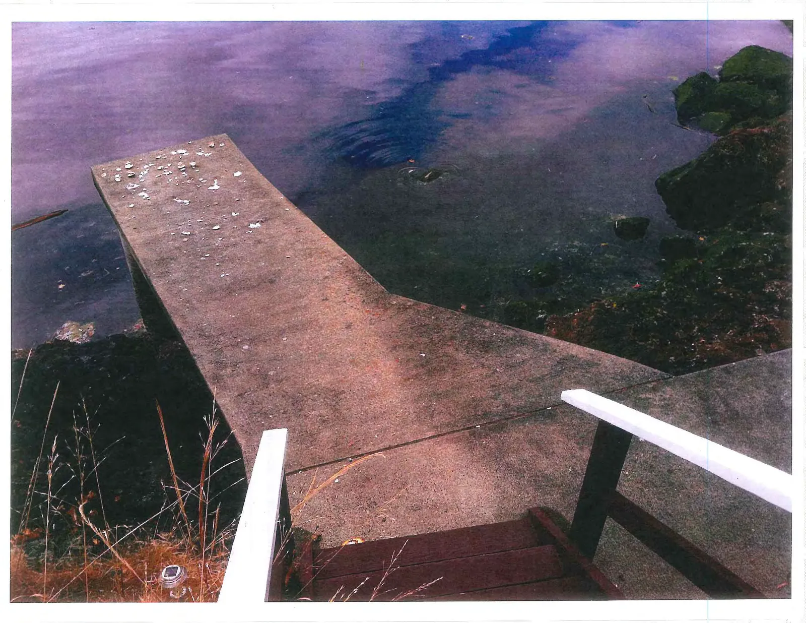 Overhead view of the concrete platform with wooden stairs leading down to the area.