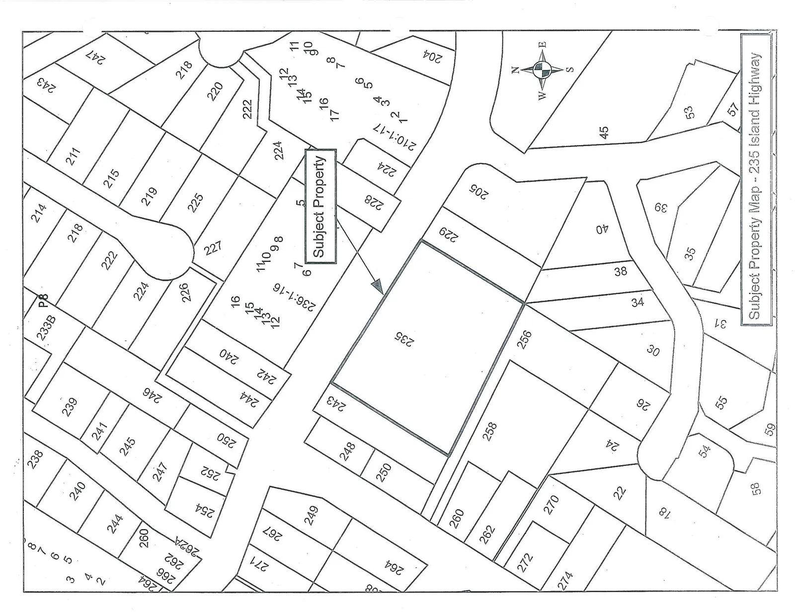Map showing various property parcels with 235 Island Highway identified as the "Subject Property". Neighboring parcels are labeled with address numbers, including clusters marked 236:1-16 and 210:1-17. A compass rose in the lower right indicates North.