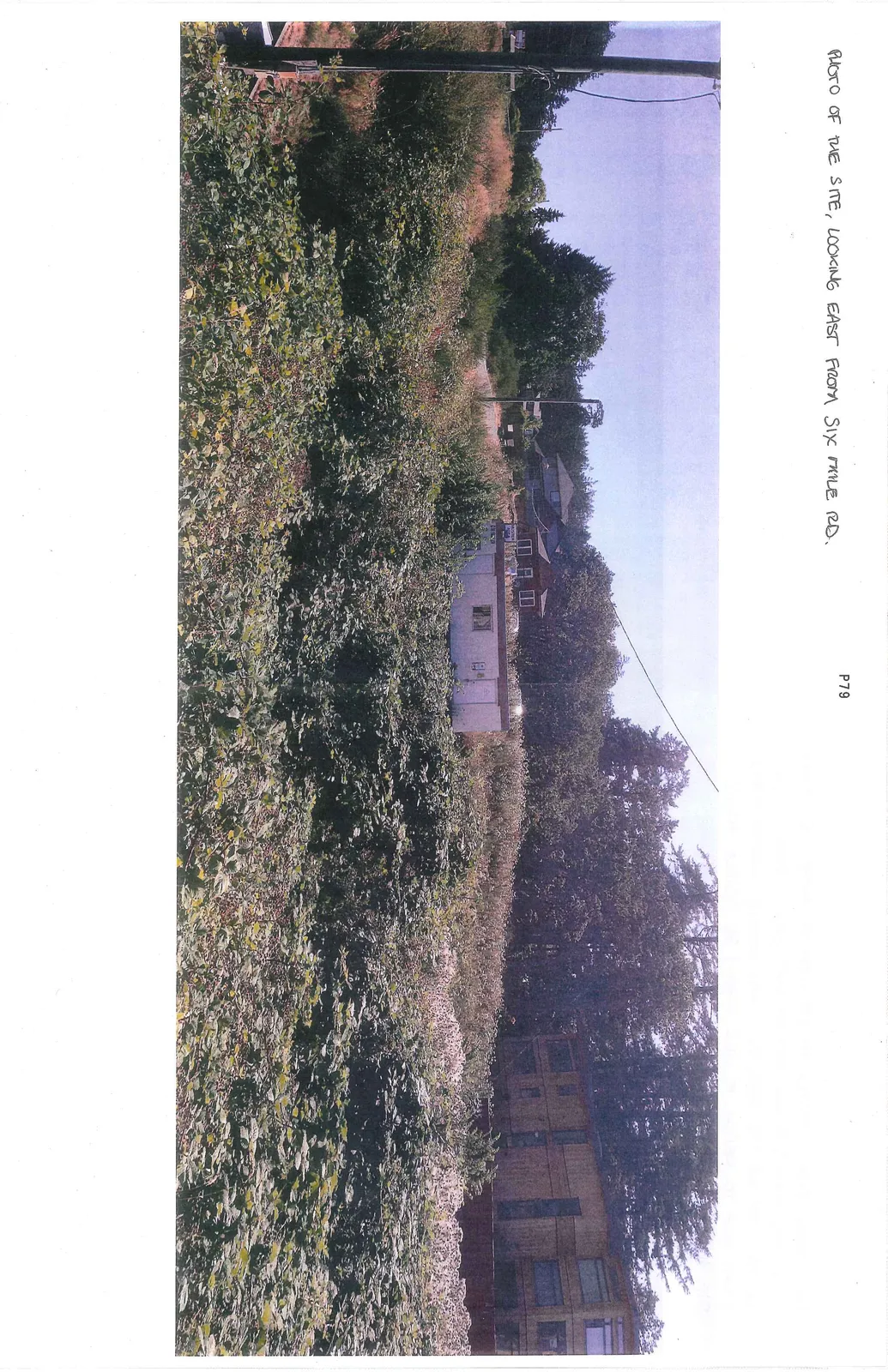 Panoramic photograph taken from the approximate location of the proposed higher eastern sign looking toward nearby residential areas and the highway