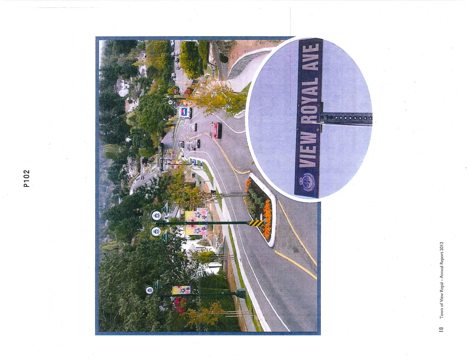 Photo of a landscaped road with a "View Royal Ave" street sign inset